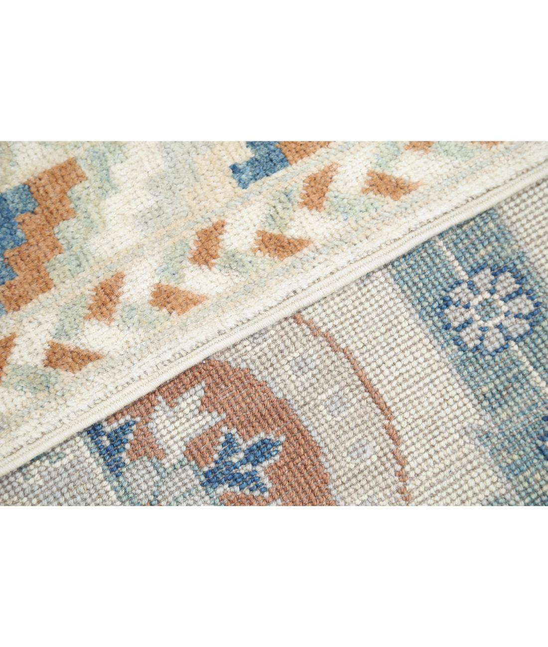 Hand Knotted Khotan Wool Rug - 9'4'' x 12'0''