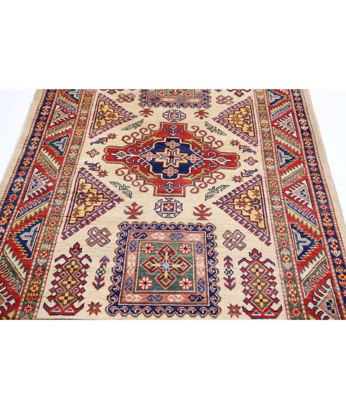 Hand Knotted Tribal Kazak Wool Rug - 4'9'' x 6'7'' 4' 9" X 6' 7" (145 X 201) / Ivory / Red